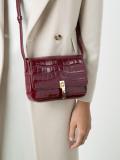 crocodile-embossed satchel