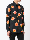 orange print shirt