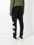 leaf print track pants