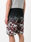 camouflage print track shorts