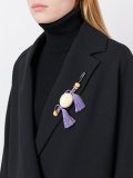 tasseled brooch