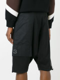 drop crotch track shorts