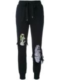 distressed track pants