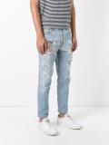 tiger embroidered distressed jeans