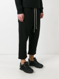 drop-crotch track pants
