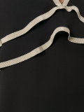 vest with contrast colour neck and frill detail