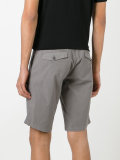 shorts with button closure flap pockets