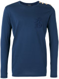 gold button logo top