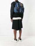 patch distressed denim backpack
