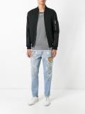 tiger embroidered distressed jeans