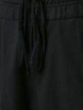 drop-crotch track pants